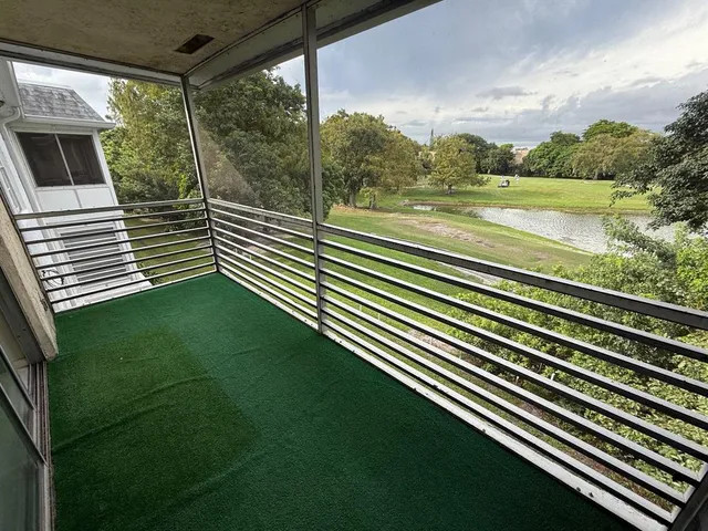 a view of a balcony with lake view and mountain view