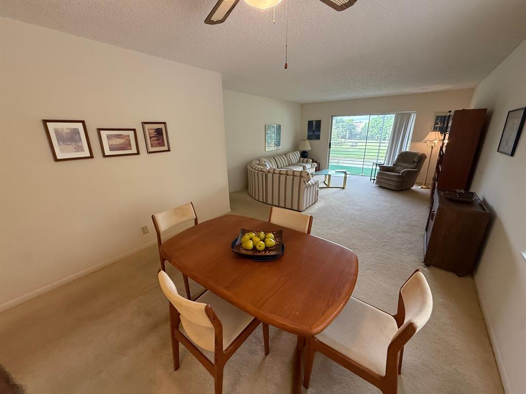 8405 Northwest 61st Street, Unit D315 Tamarac, FL 33321 - Photo 7 of 26 a view of a dining room with furniture