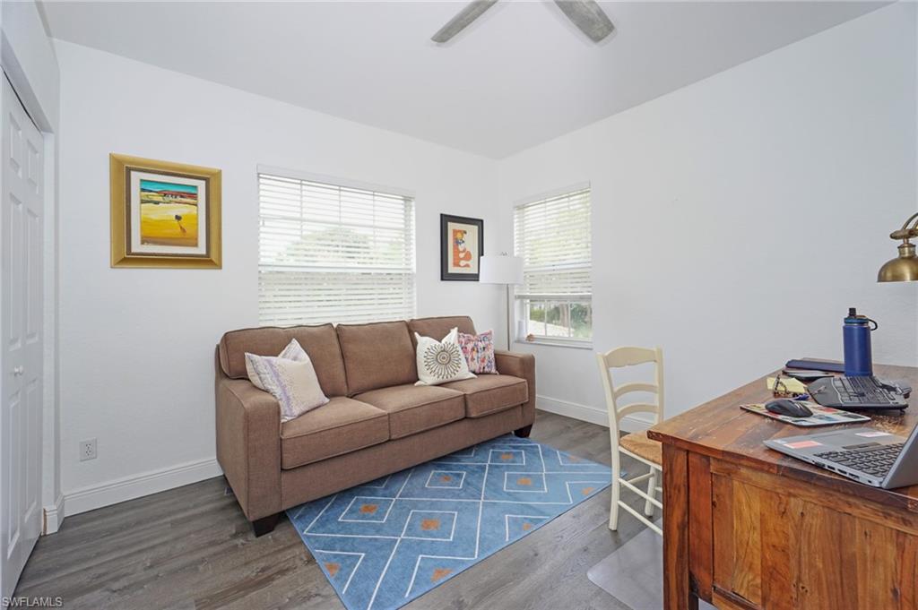 6910 Satinleaf Road North, Unit 204 Naples, FL 34109 - Photo 20 of 31 Living room featuring baseboards, ceiling fan, and wood finished floors