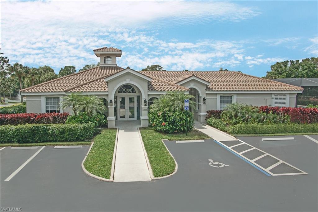 6910 Satinleaf Road North, Unit 204 Naples, FL 34109 - Photo 27 of 31 View of building exterior with uncovered parking