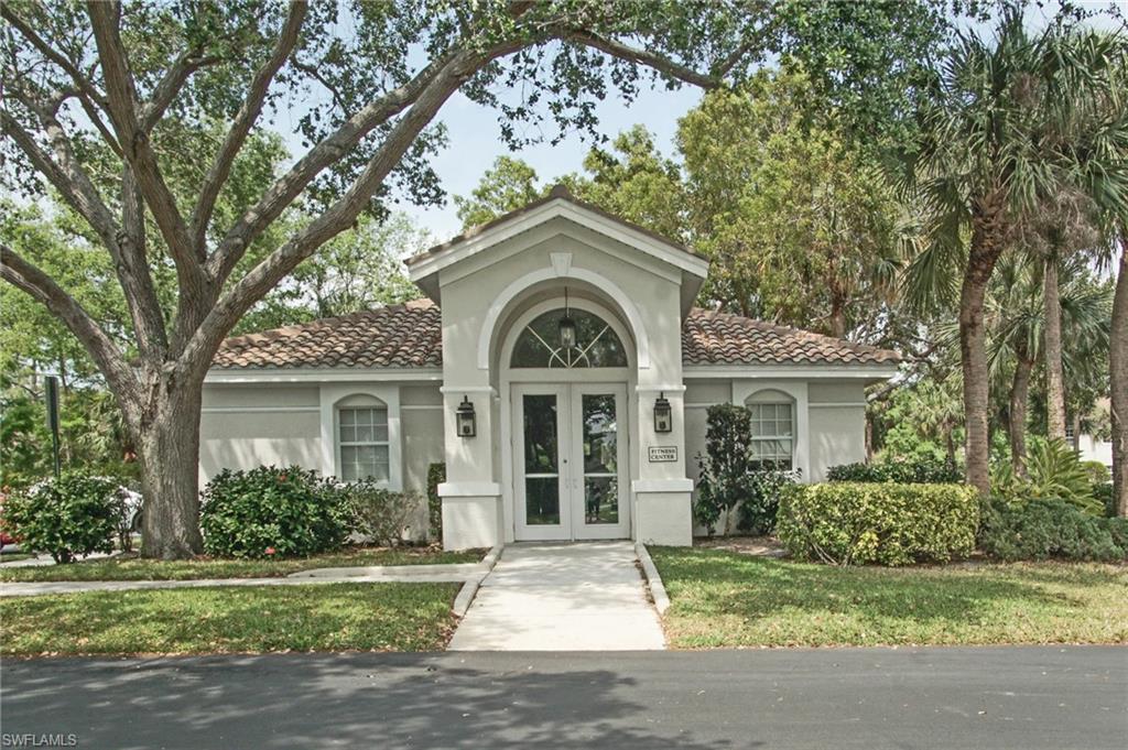 6910 Satinleaf Road North, Unit 204 Naples, FL 34109 - Photo 30 of 31 Mediterranean / spanish home featuring stucco siding, a tiled roof, and french doors