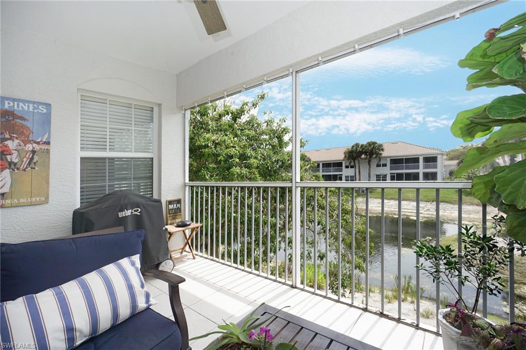 6910 Satinleaf Road North, Unit 204 Naples, FL 34109 - Photo 10 of 31 Balcony featuring grilling area and a ceiling fan