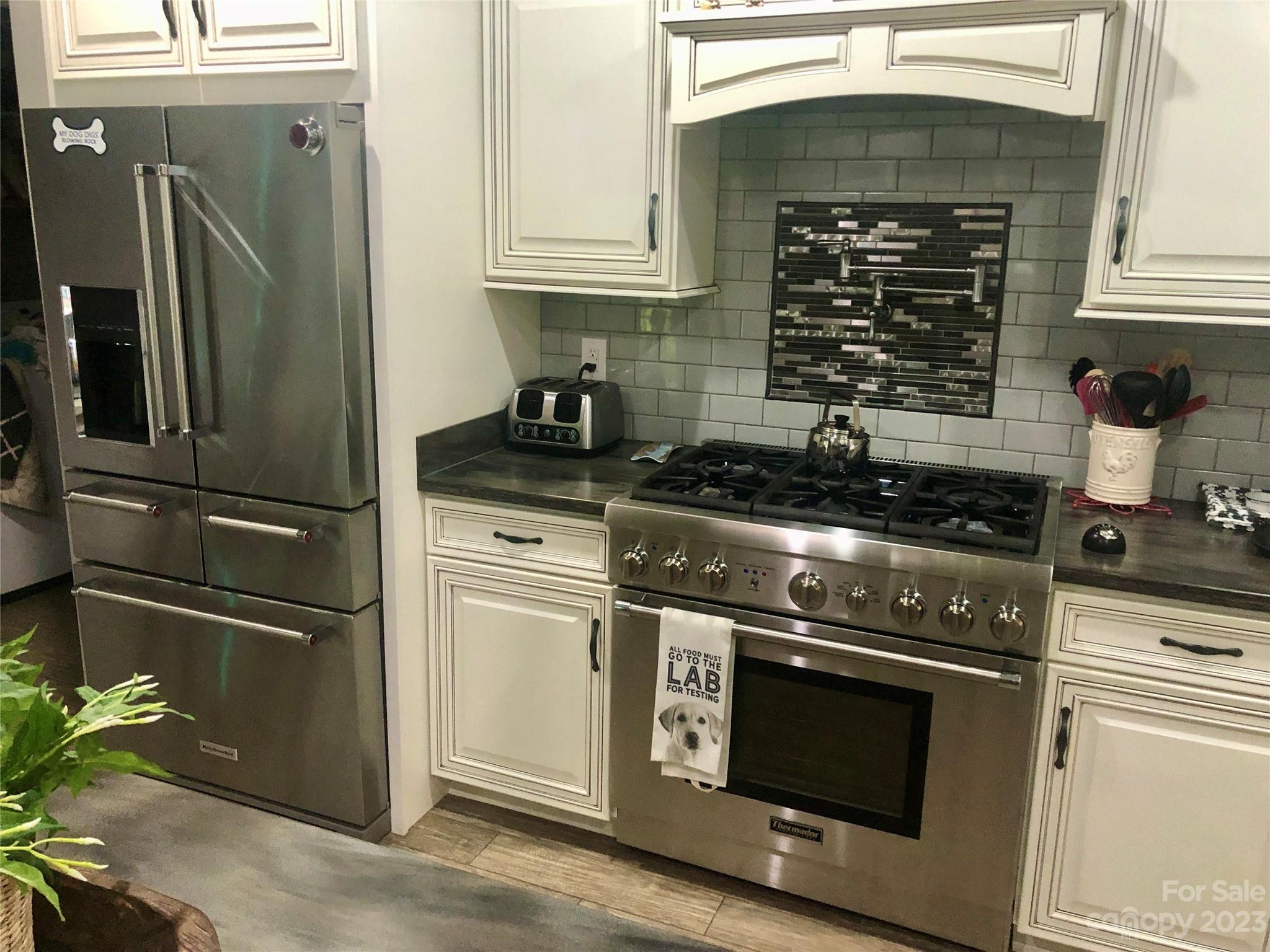 213 Forest Ridge Drive Rutherfordton, NC 28139 - Photo 3 of 5 a kitchen with appliances and cabinets