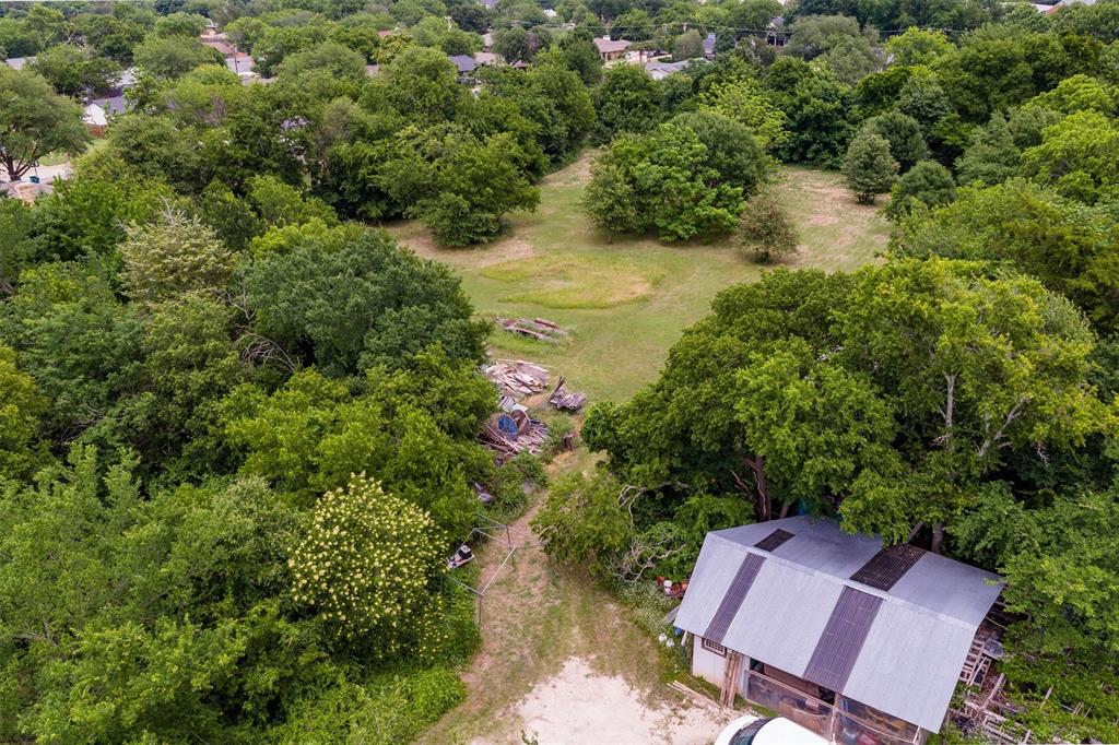 1007 West Belt Line Road Cedar Hill, TX 75104 - Photo 15 of 30 Expansive lot featuring a mix of mature trees and open grassy areas
