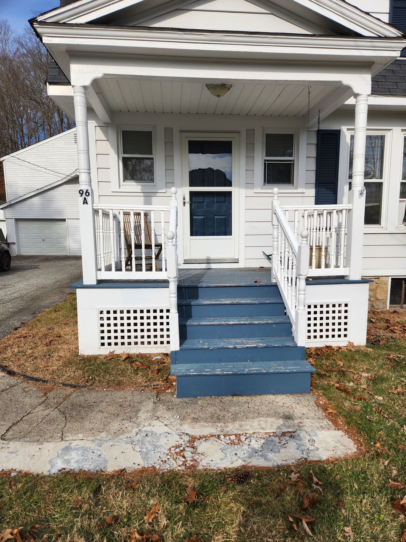 a front view of a house with wooden fence