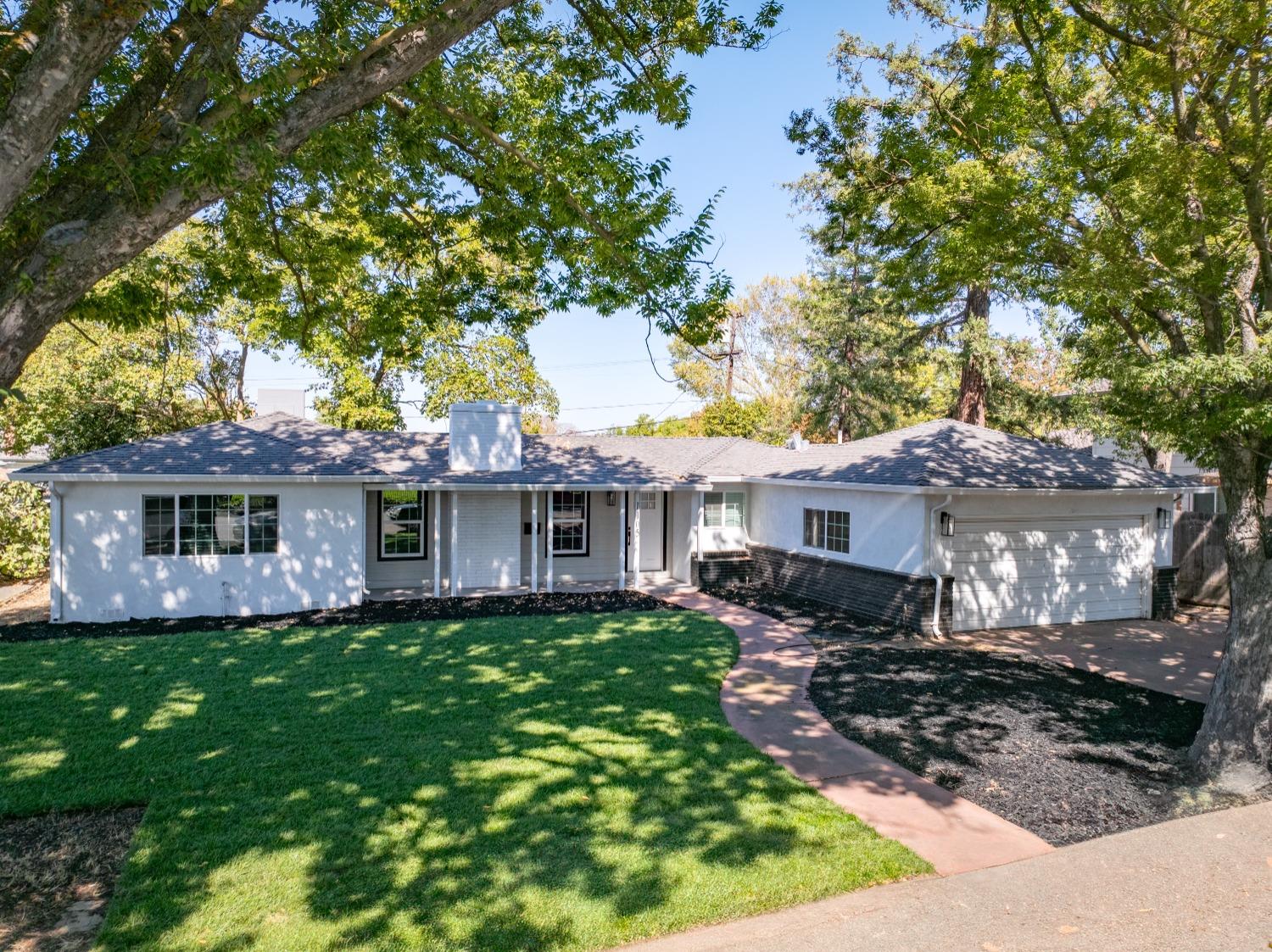 1105 Brookside Road Stockton, CA 95207 - Photo 1 of 1 a house view with a sitting space and garden