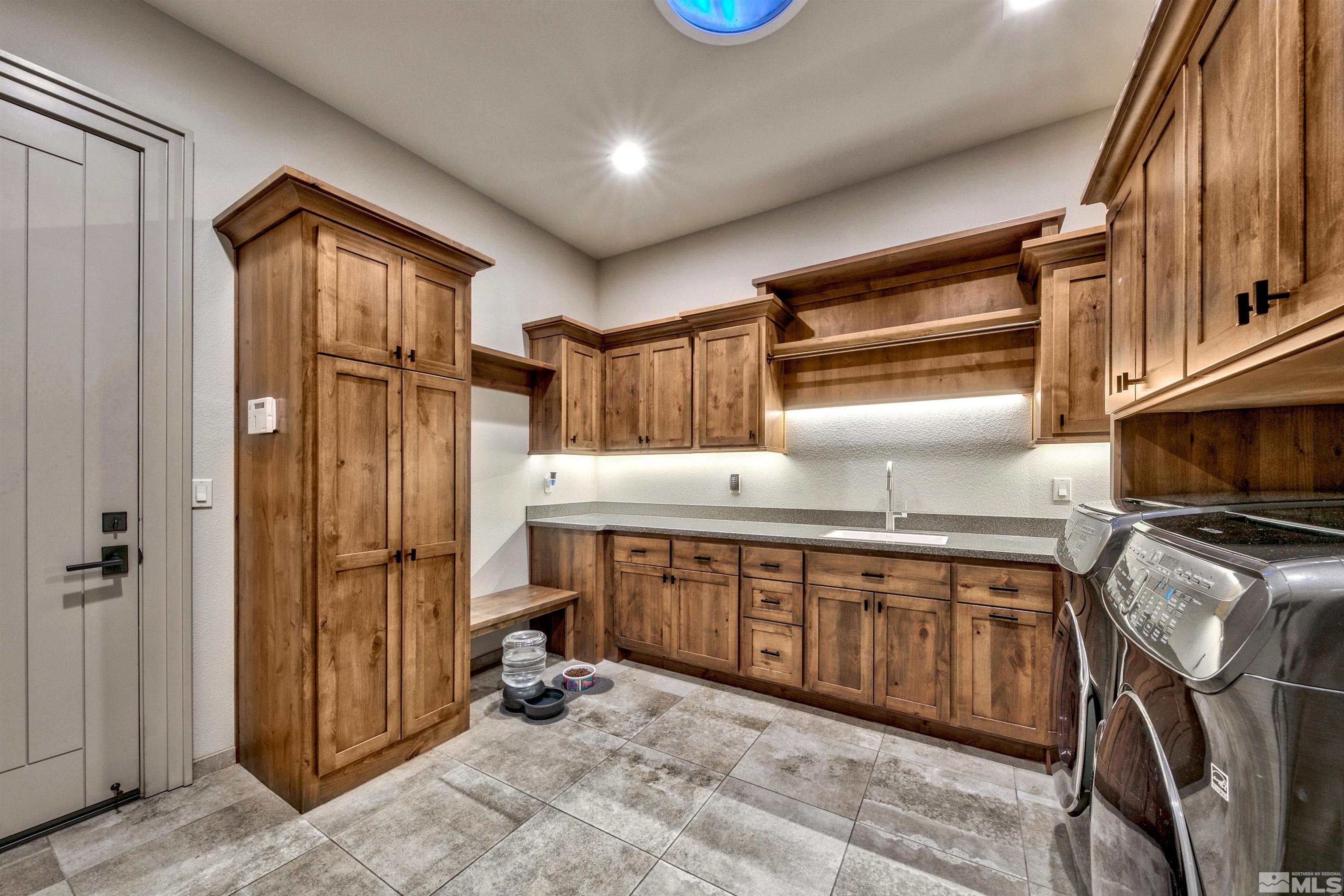 316 James Canyon Loop Genoa, NV 89411 - Photo 24 of 40 a kitchen with stainless steel appliances granite countertop a sink refrigerator and cabinets