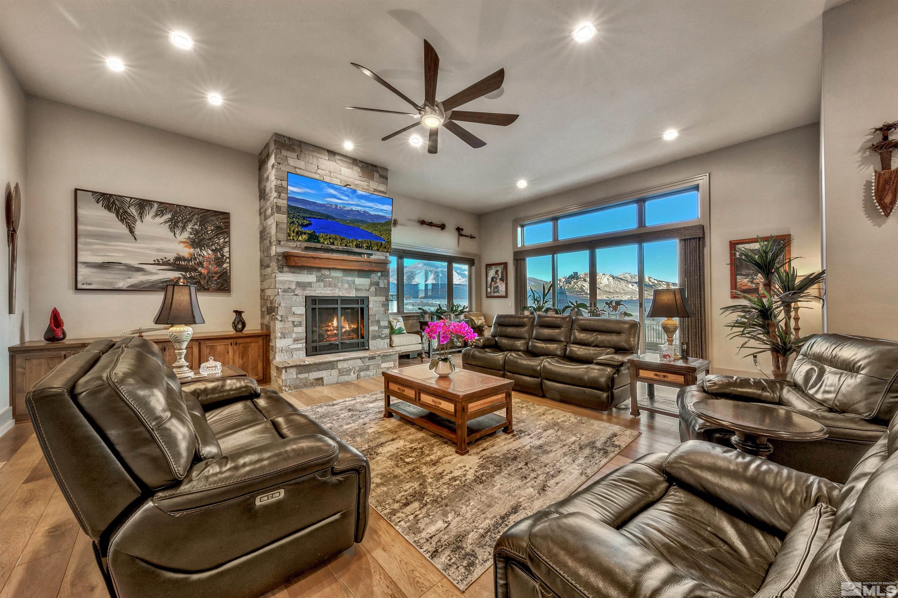 316 James Canyon Loop Genoa, NV 89411 - Photo 4 of 40 a living room with furniture fireplace and flat screen tv