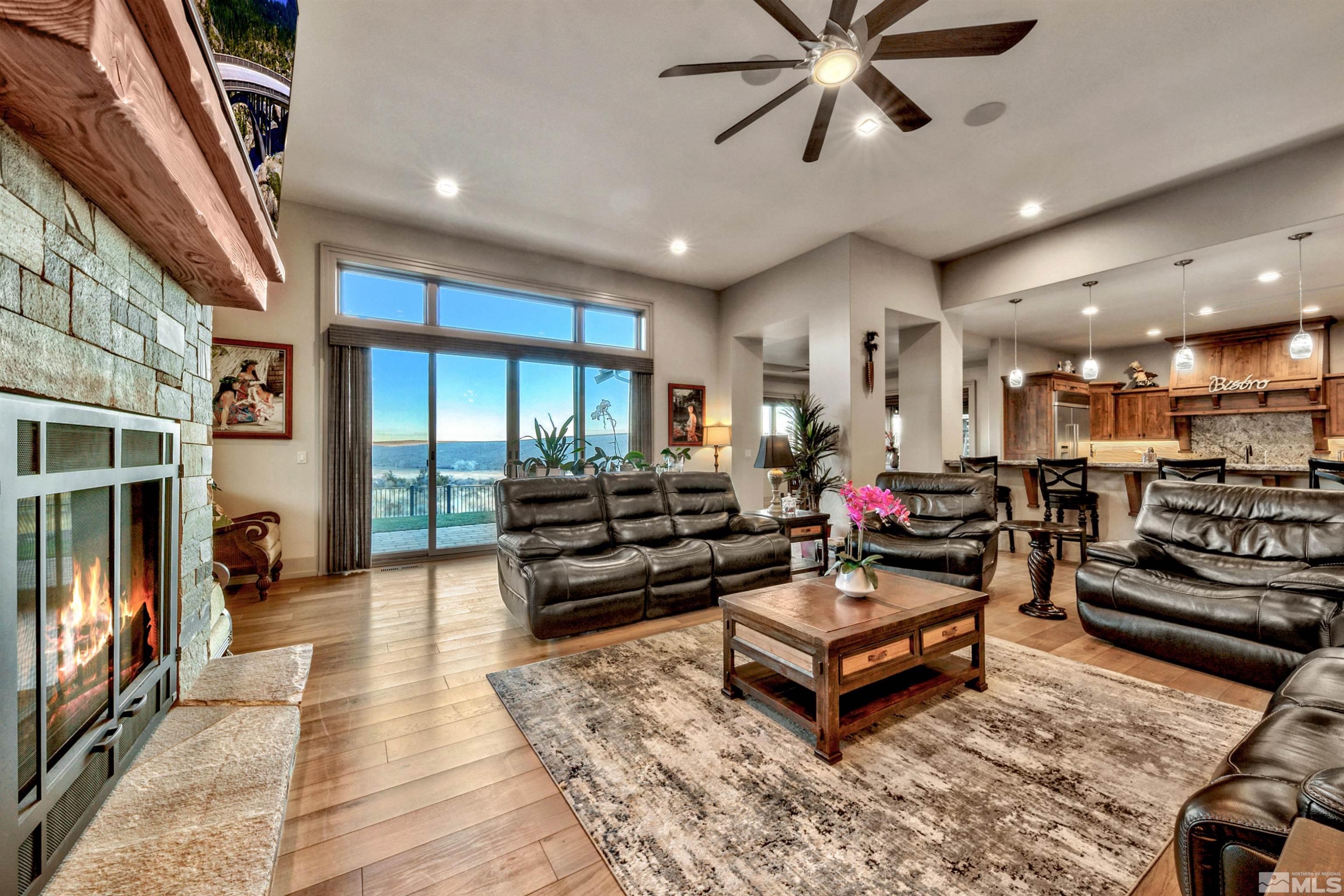 316 James Canyon Loop Genoa, NV 89411 - Photo 5 of 40 a living room with furniture a ceiling fan and a rug