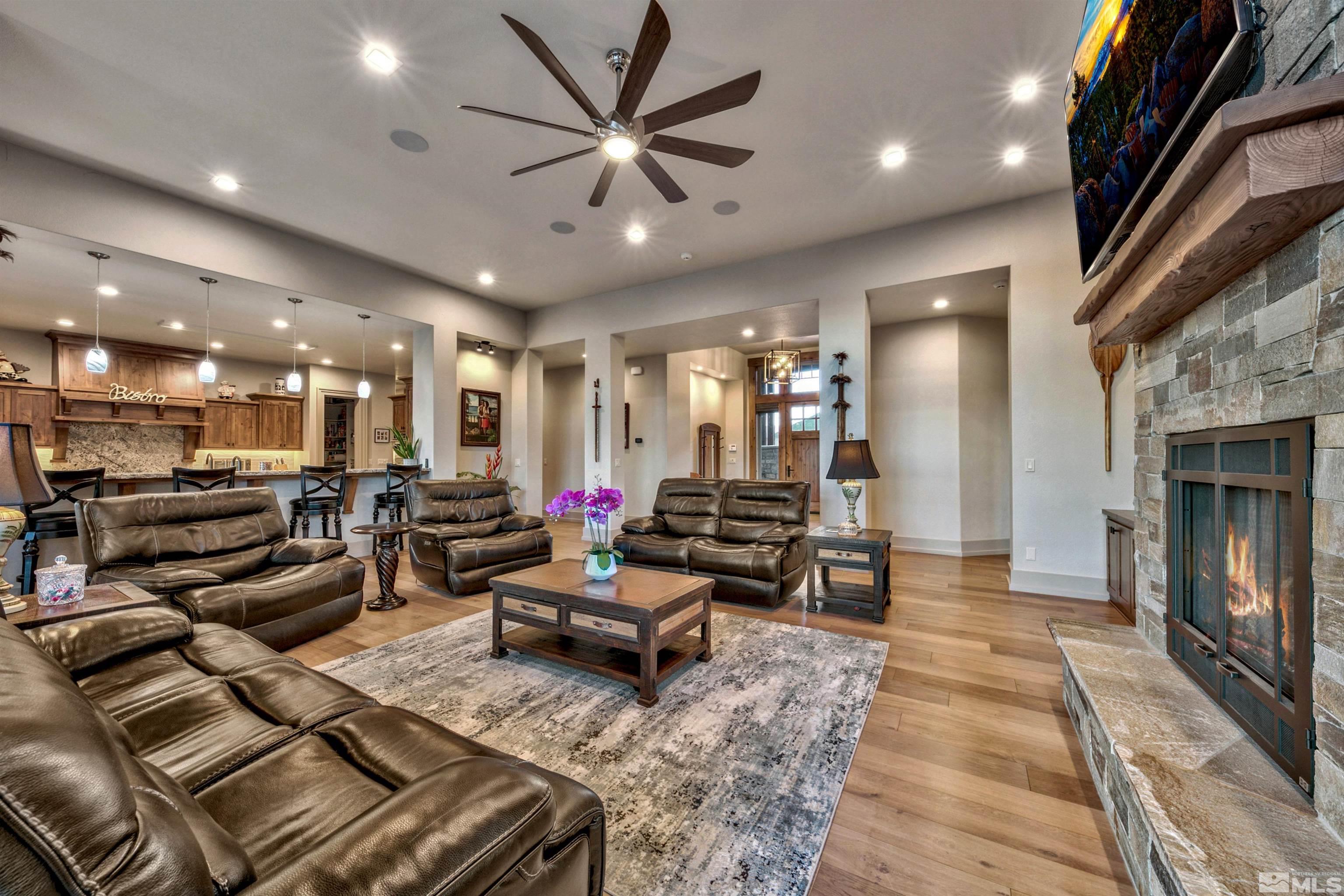 316 James Canyon Loop Genoa, NV 89411 - Photo 6 of 40 a living room with lots of furniture and a fireplace