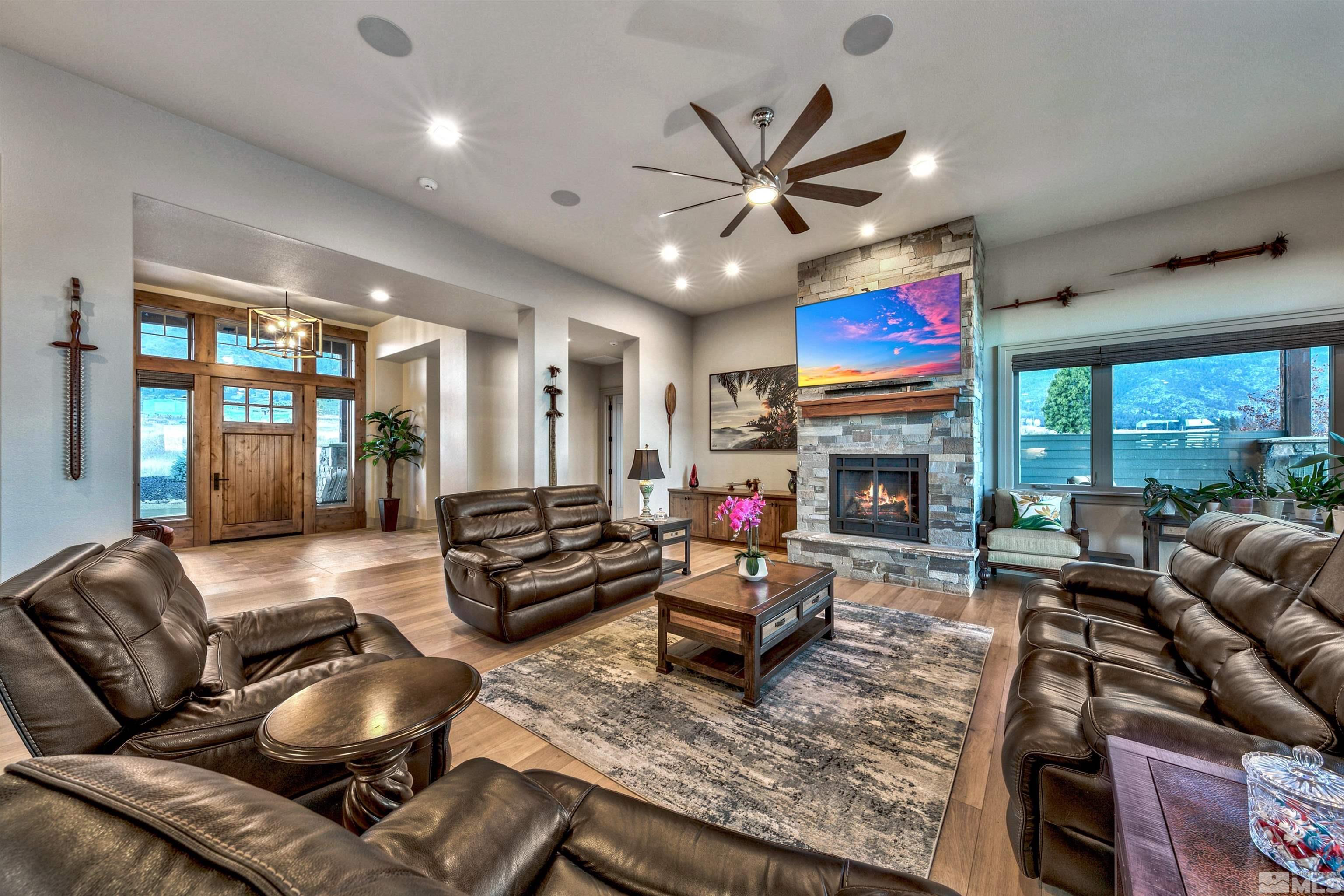 316 James Canyon Loop Genoa, NV 89411 - Photo 7 of 40 a living room with furniture fireplace and flat screen tv