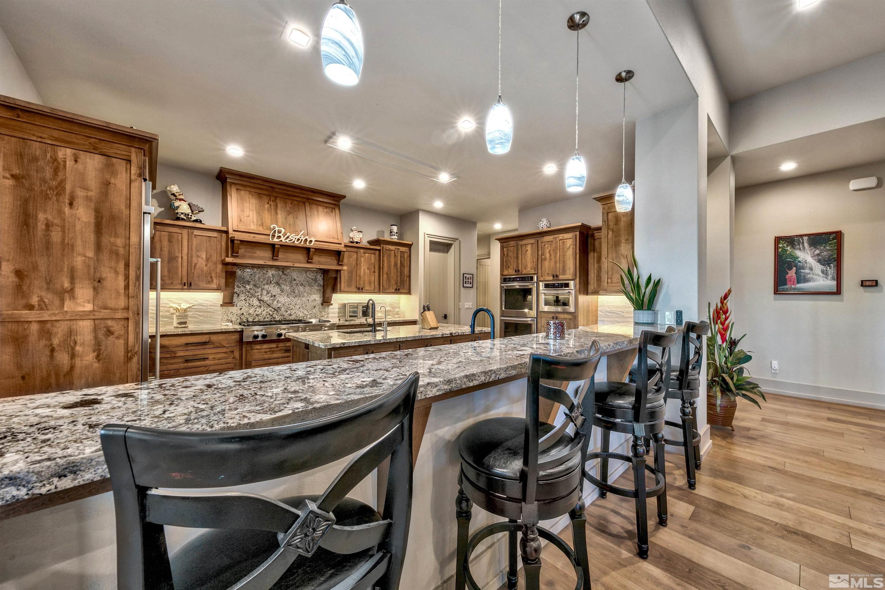 316 James Canyon Loop Genoa, NV 89411 - Photo 8 of 40 a kitchen with a table and chairs in it