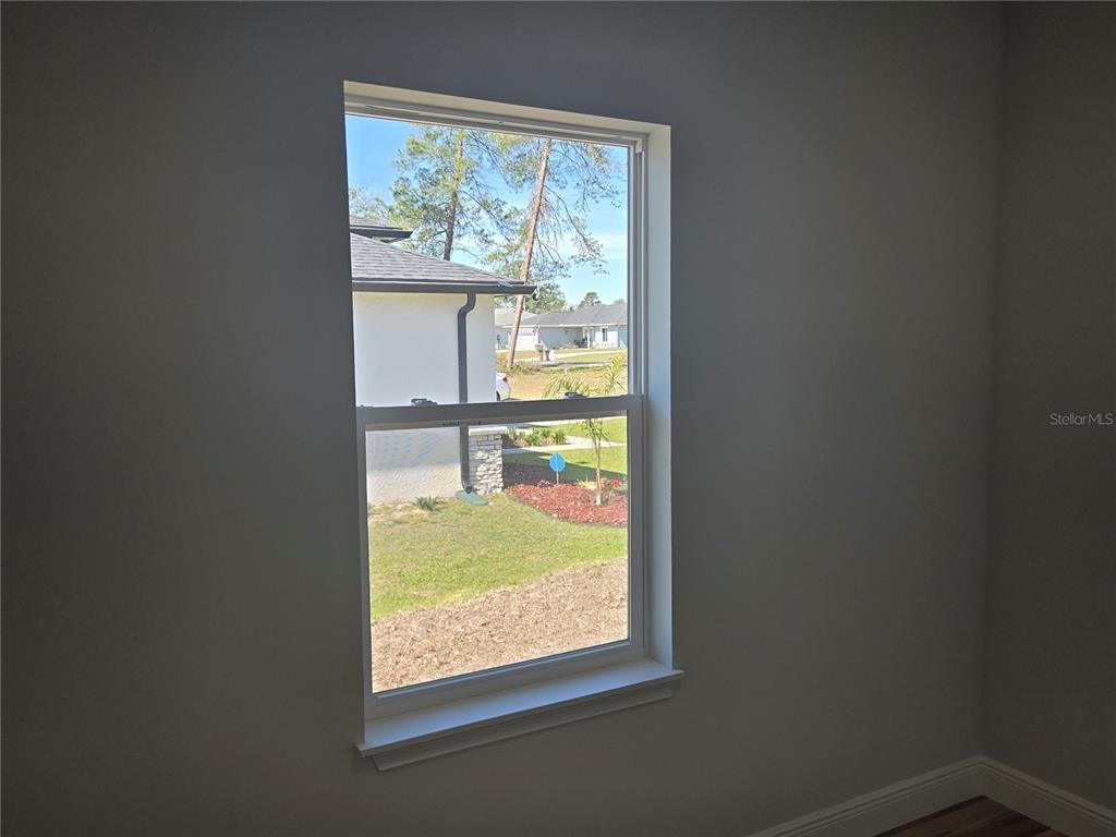 2644 Southwest 162nd Street Road Ocala, FL 34473 - Photo 29 of 47 a view of an empty room with a window
