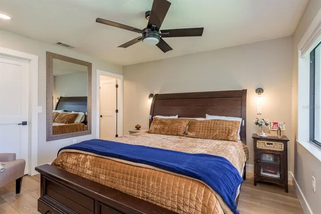 a bedroom with a bed and dresser