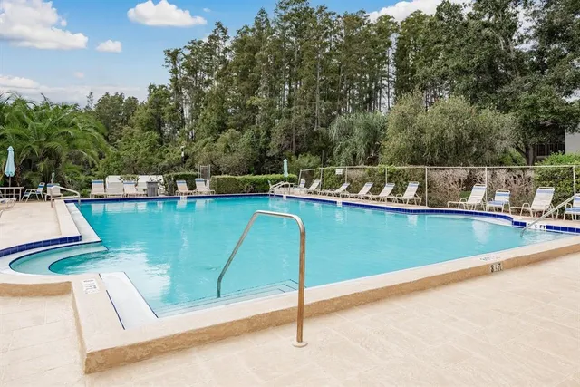 a view of a swimming pool with a chair