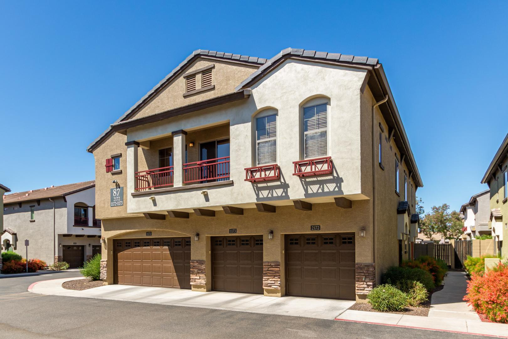 2725 East Mine Creek Road, Unit 2172 Phoenix, AZ 85024 - Photo 2 of 28 a front view of a residential apartment building with a yard
