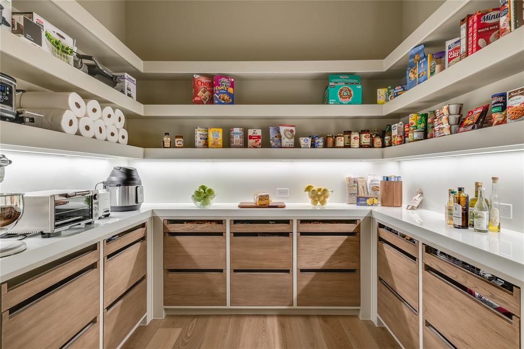 4306 Gloster Road Dallas, TX 75220 - Photo 14 of 28 a kitchen with cabinets and window