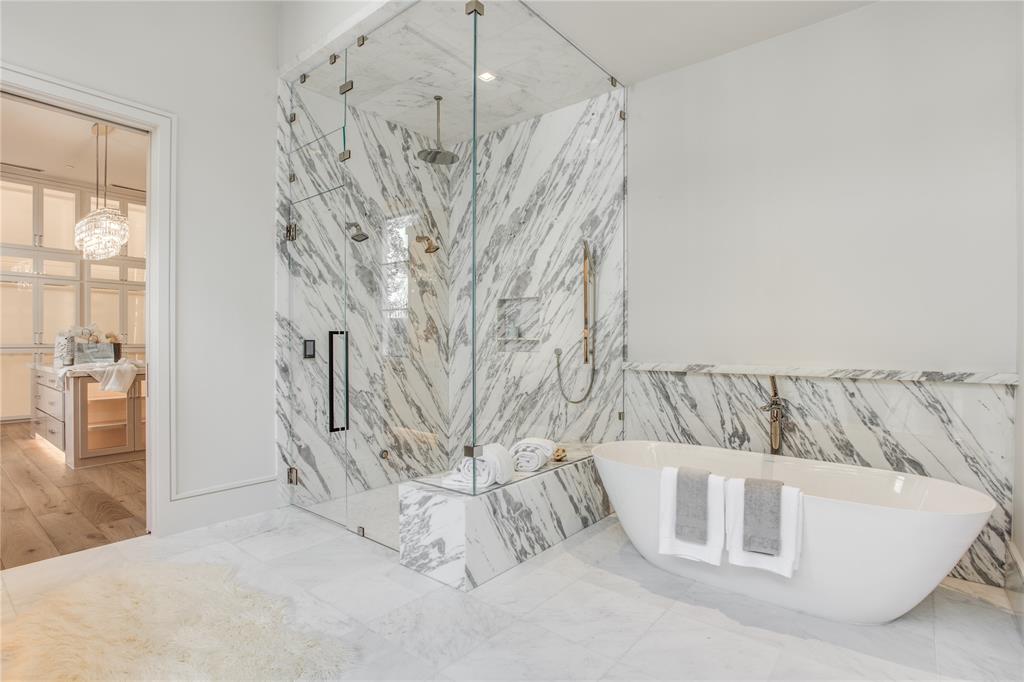 4306 Gloster Road Dallas, TX 75220 - Photo 19 of 28 a white bath tub sitting in a bathroom