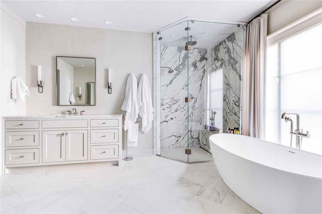 4306 Gloster Road Dallas, TX 75220 - Photo 20 of 28 a large spacious bathroom with a double vanity sink a mirror a bathtub and a shower