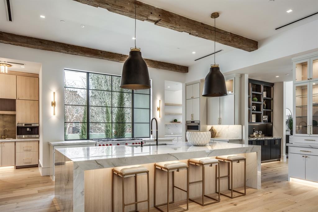 4306 Gloster Road Dallas, TX 75220 - Photo 9 of 28 a kitchen with stainless steel appliances granite countertop a sink and a refrigerator