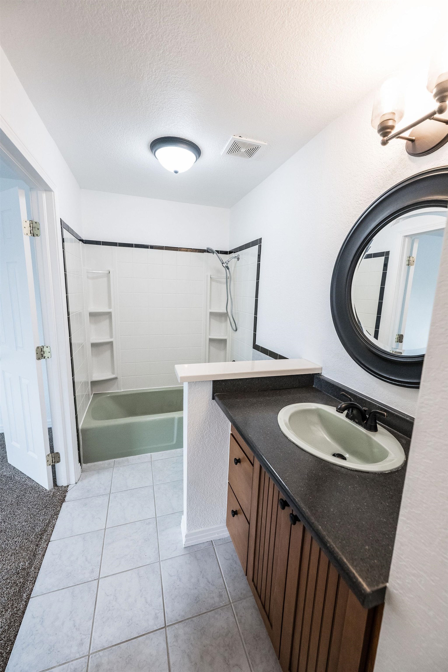 2721 Patterson Road, Unit 104 Grand Junction, CO 81506 - Photo 12 of 20 a bathroom with a granite countertop sink a toilet and a mirror