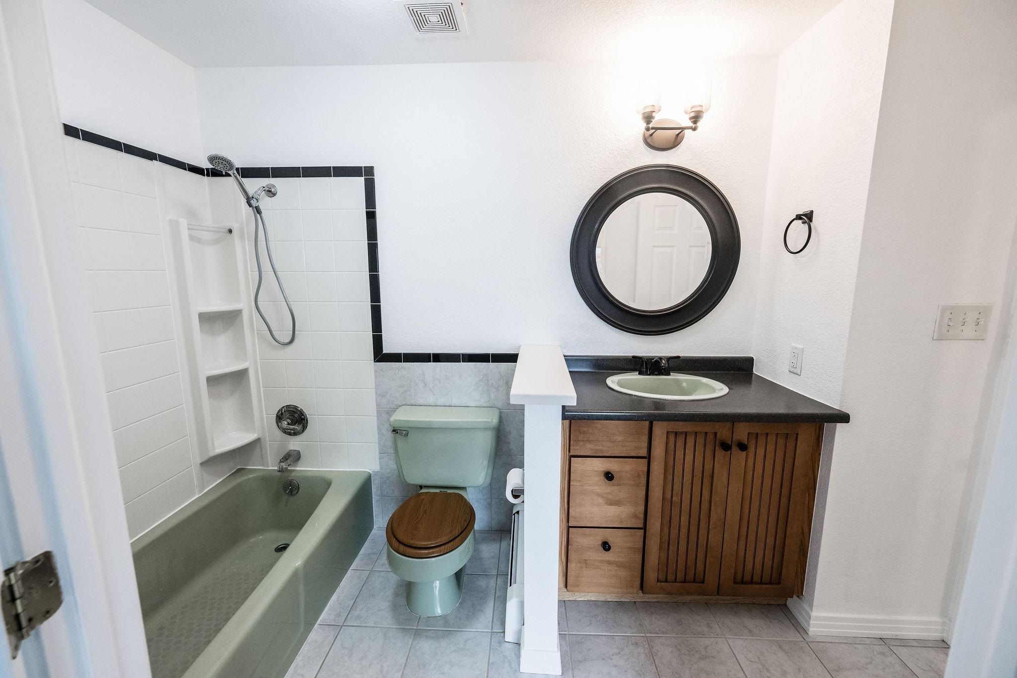 2721 Patterson Road, Unit 104 Grand Junction, CO 81506 - Photo 13 of 20 a bathroom with a granite countertop sink a mirror and a shower