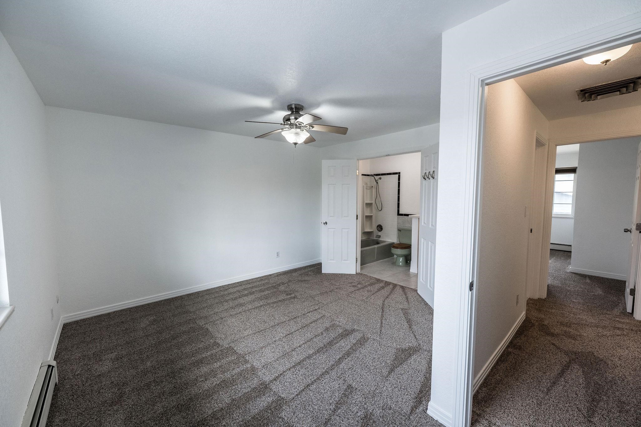 2721 Patterson Road, Unit 104 Grand Junction, CO 81506 - Photo 15 of 20 wooden floor in an empty room and a bathroom