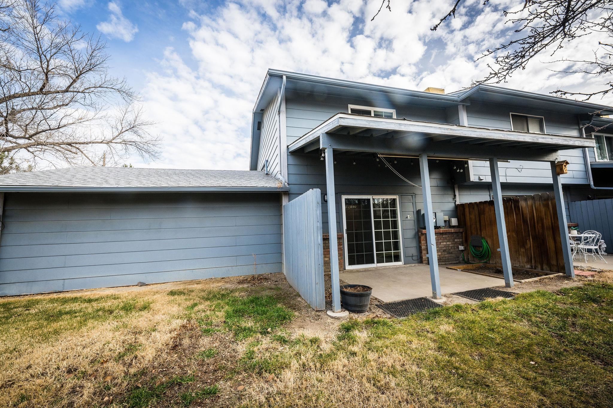 2721 Patterson Road, Unit 104 Grand Junction, CO 81506 - Photo 20 of 20 a view of a house with a large window and wooden fence