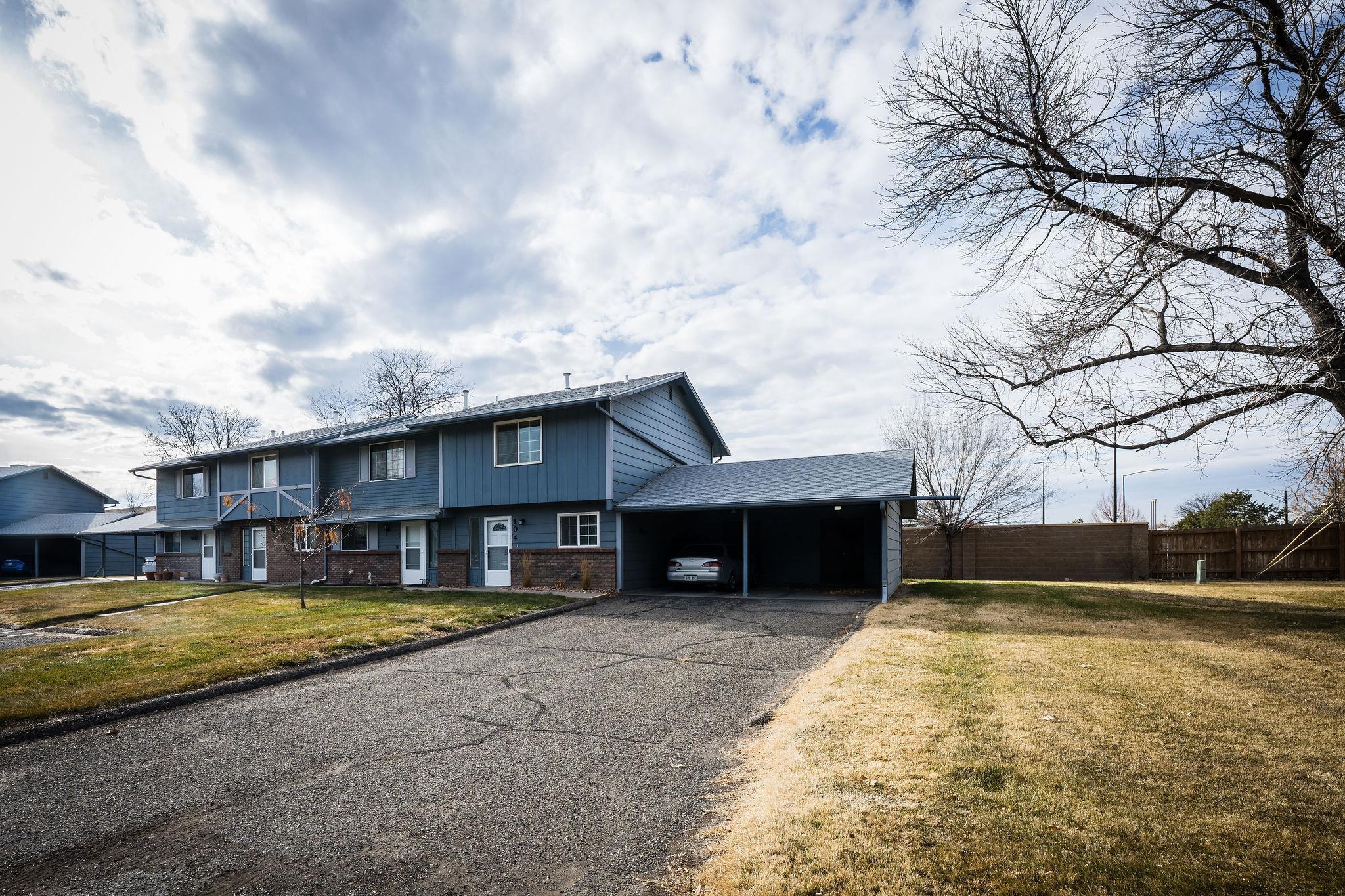2721 Patterson Road, Unit 104 Grand Junction, CO 81506 - Photo 2 of 20 a front view of a house with a yard