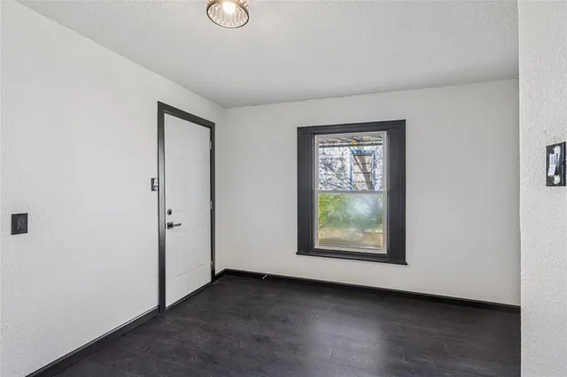 a kitchen with stainless steel appliances a stove sink microwave and cabinets