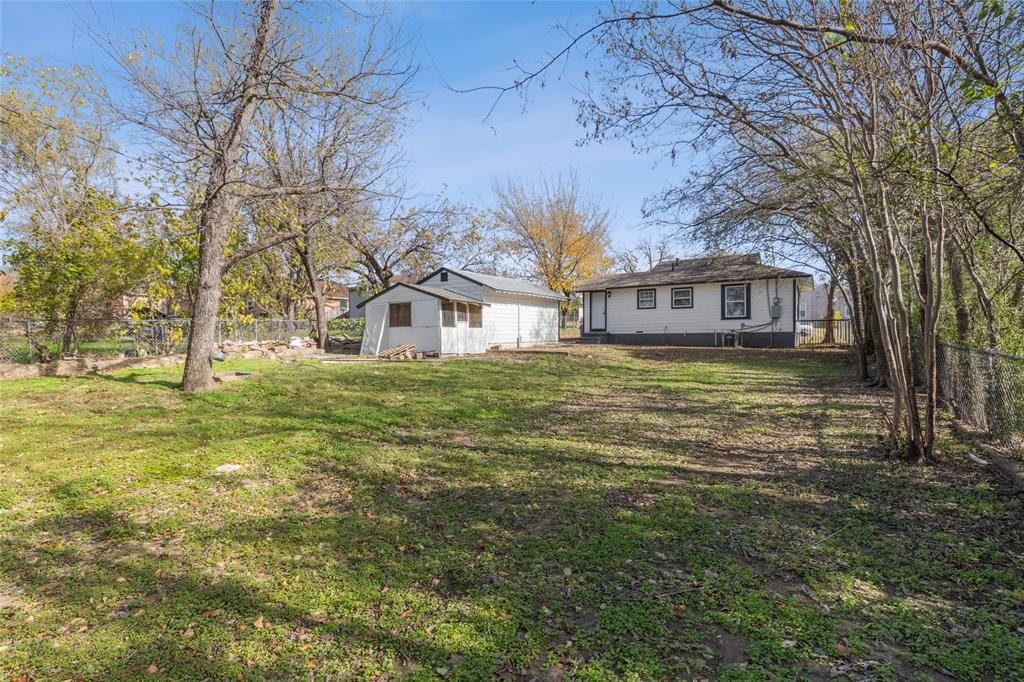 4816 Foard Street Fort Worth, TX 76119 - Photo 21 of 25 a view of a house with a yard