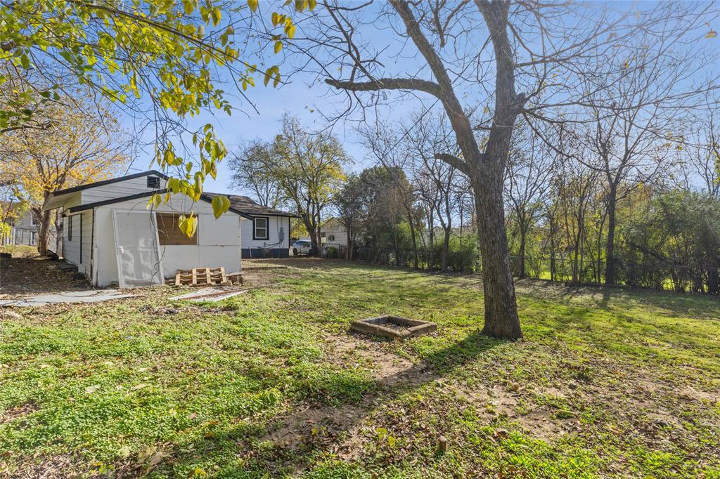 4816 Foard Street Fort Worth, TX 76119 - Photo 24 of 25 a backyard of a house with lots of green space