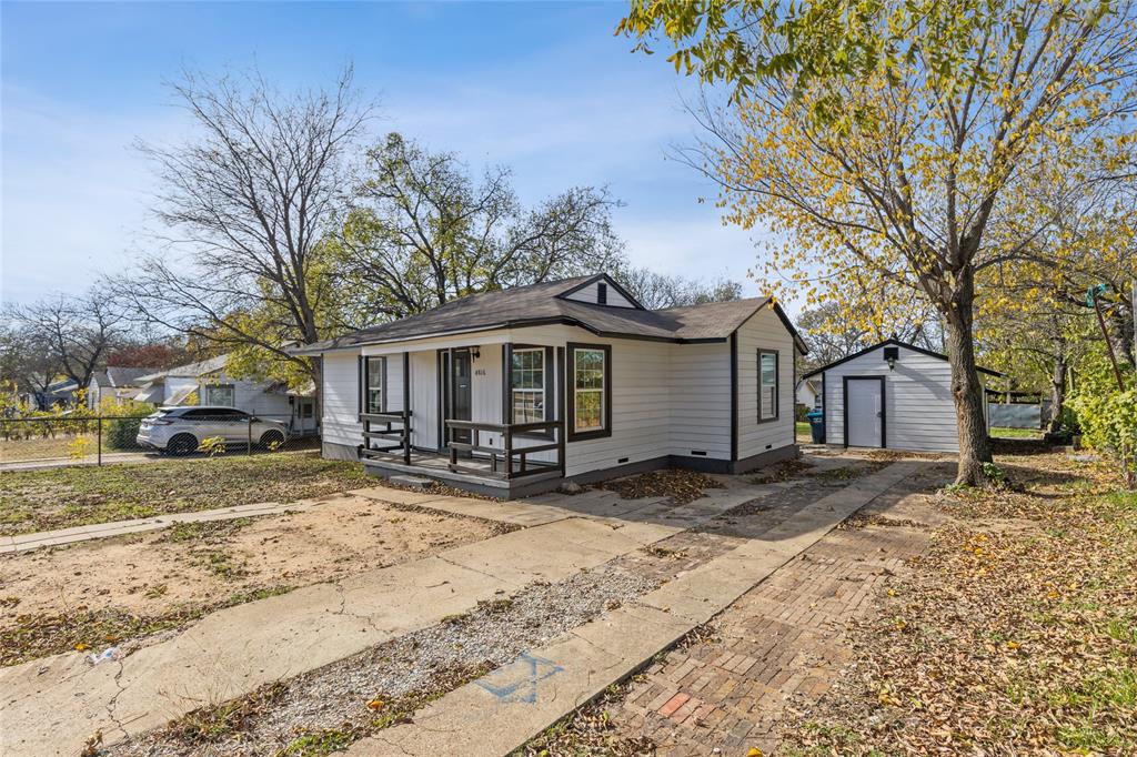 4816 Foard Street Fort Worth, TX 76119 - Photo 5 of 25 a view of a house with a yard covered in snow