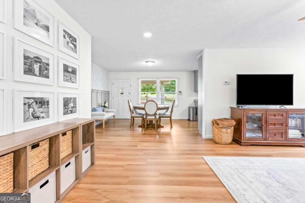 764 Sandy Cross Road Lexington, GA 30648 - Photo 13 of 52 a living room with furniture and a flat screen tv