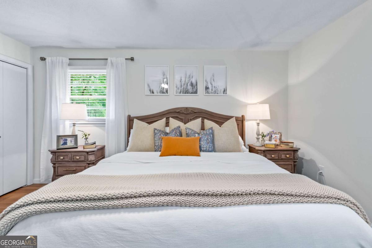 764 Sandy Cross Road Lexington, GA 30648 - Photo 27 of 52 a bedroom with a bed and window