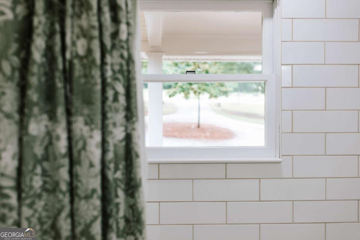 764 Sandy Cross Road Lexington, GA 30648 - Photo 29 of 52 a view of a glass door with a yard from a window