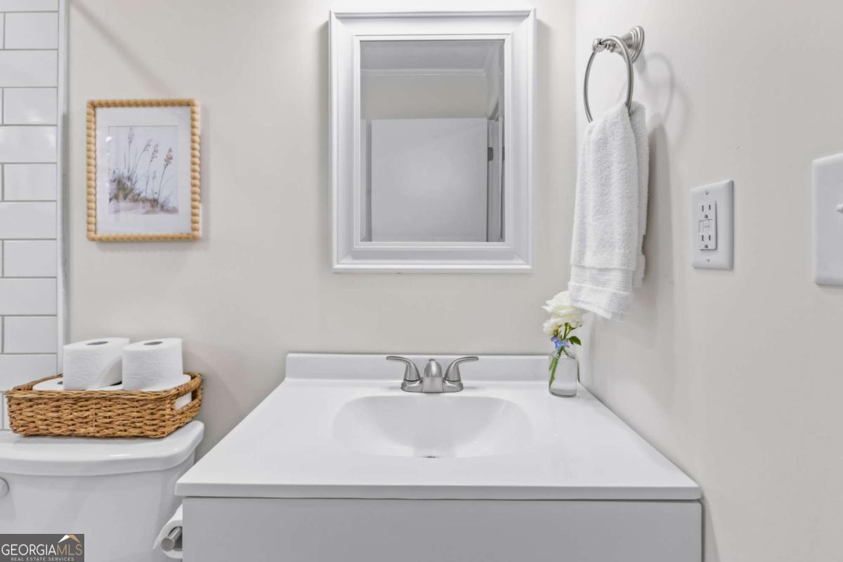 764 Sandy Cross Road Lexington, GA 30648 - Photo 30 of 52 a bathroom with a sink and a mirror