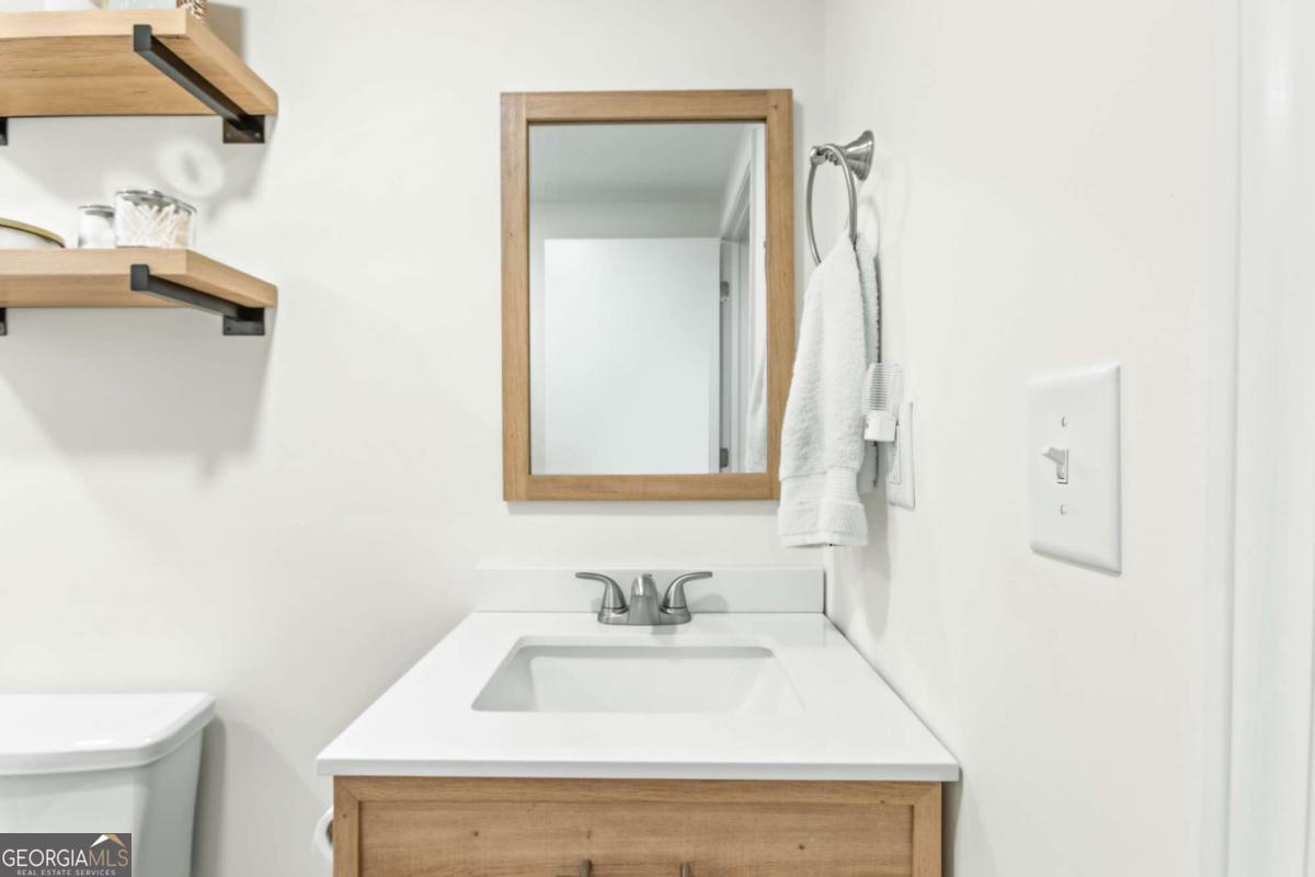 764 Sandy Cross Road Lexington, GA 30648 - Photo 37 of 52 a bathroom with a sink and a mirror
