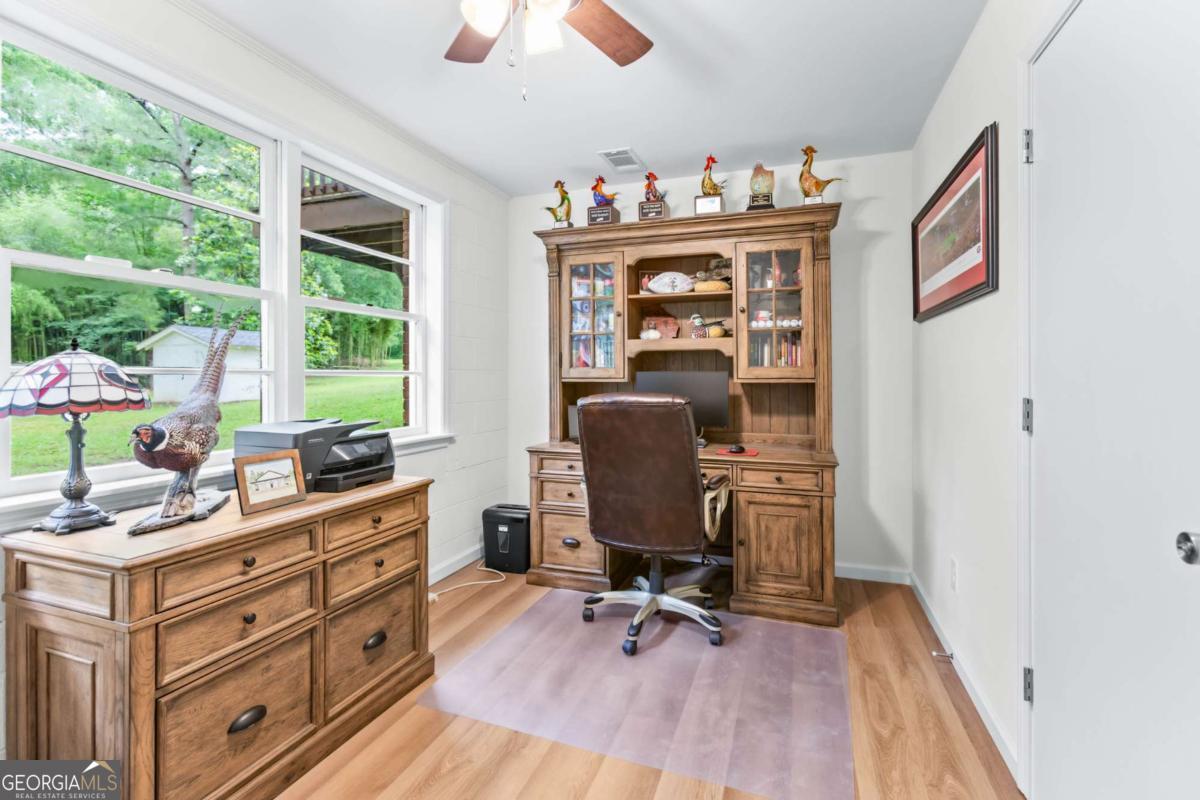 764 Sandy Cross Road Lexington, GA 30648 - Photo 41 of 52 a view of a workspace with furniture and a window