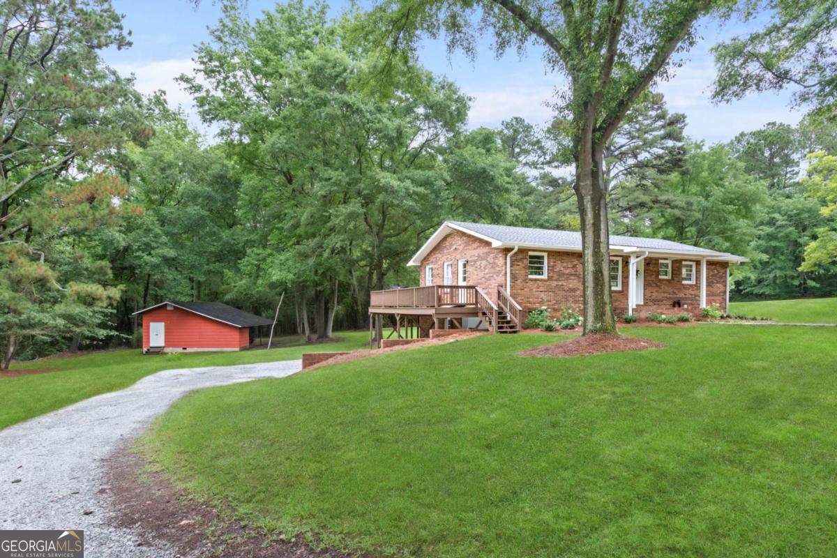 764 Sandy Cross Road Lexington, GA 30648 - Photo 47 of 52 a front view of a house with yard and green space