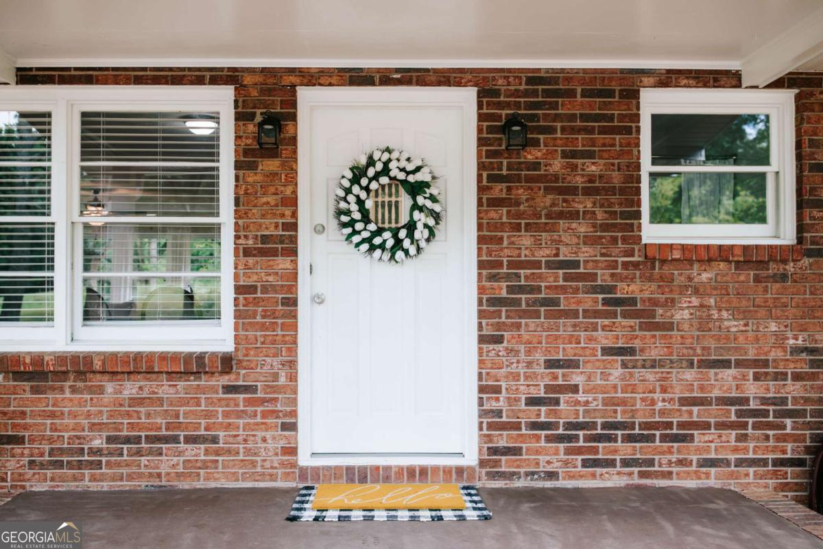 764 Sandy Cross Road Lexington, GA 30648 - Photo 7 of 52 a front view of a house with a window