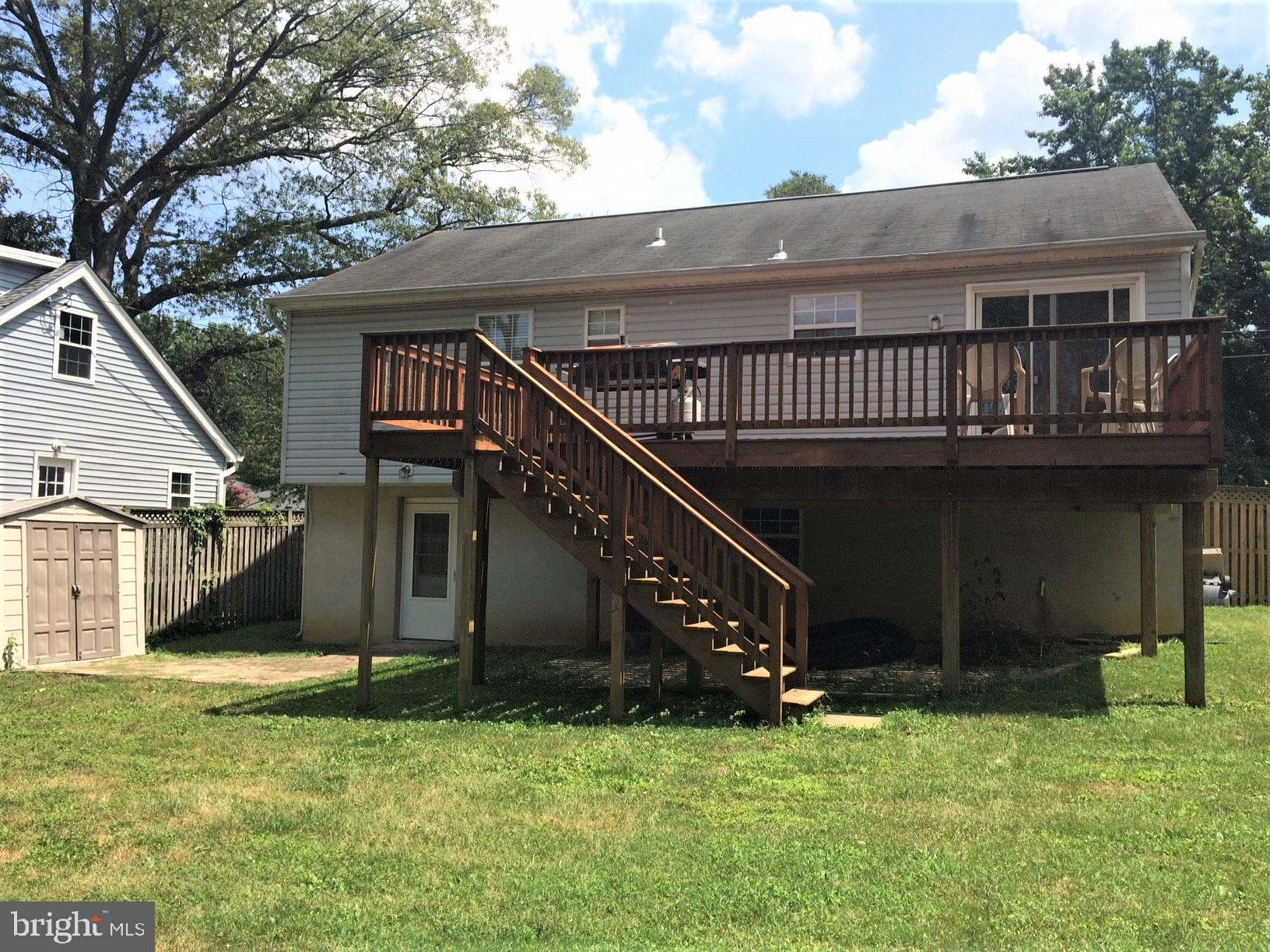316 Oakwood Road Edgewater, MD 21037 - Photo 2 of 39 Expansive Deck off DR slider has steps to rear yd