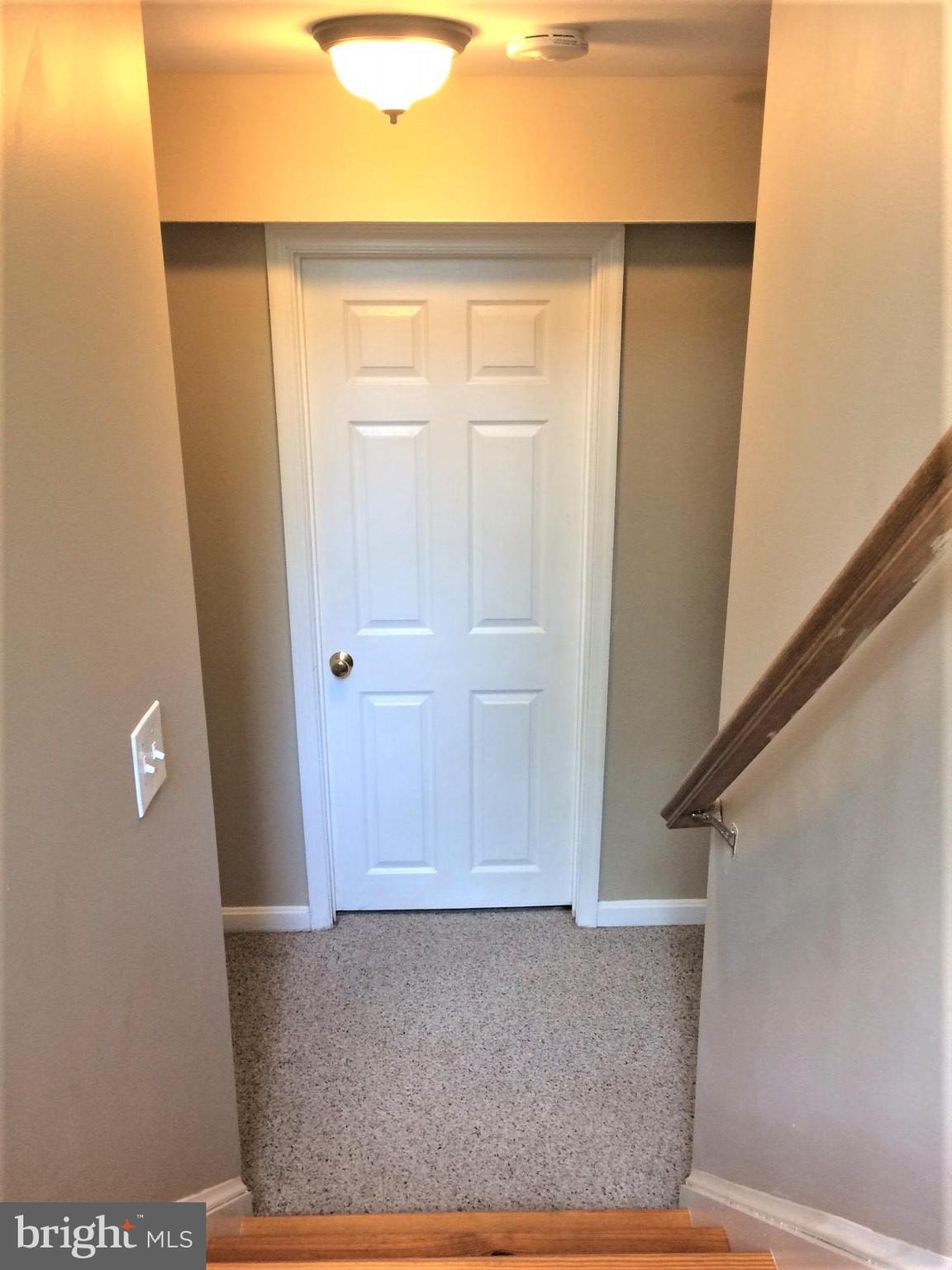 316 Oakwood Road Edgewater, MD 21037 - Photo 23 of 39 Stairs off entry lead to the carpeted Lower Level