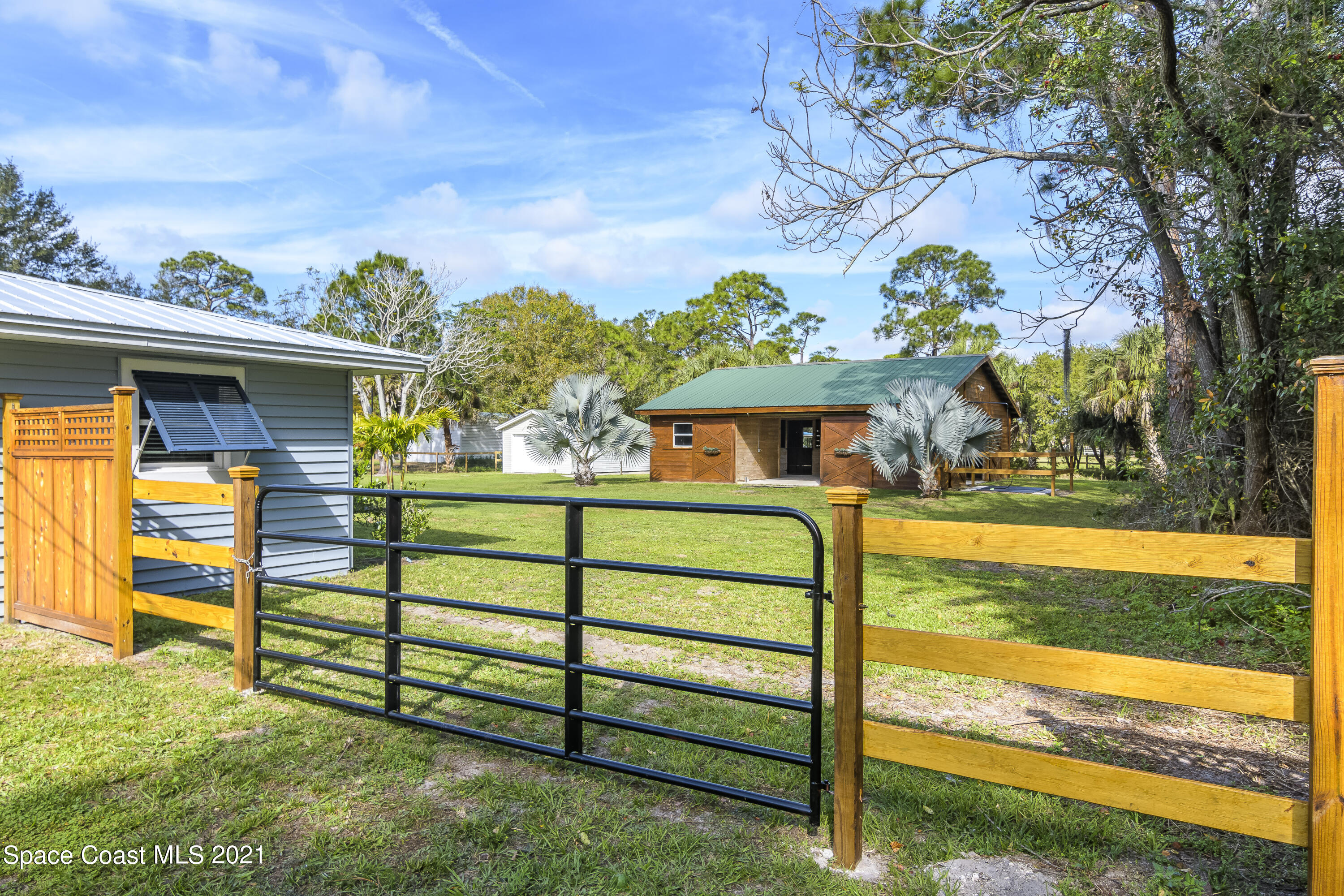 1740 Vally Road Malabar, FL 32950 - Photo 22 of 42 a front view of a house with a yard