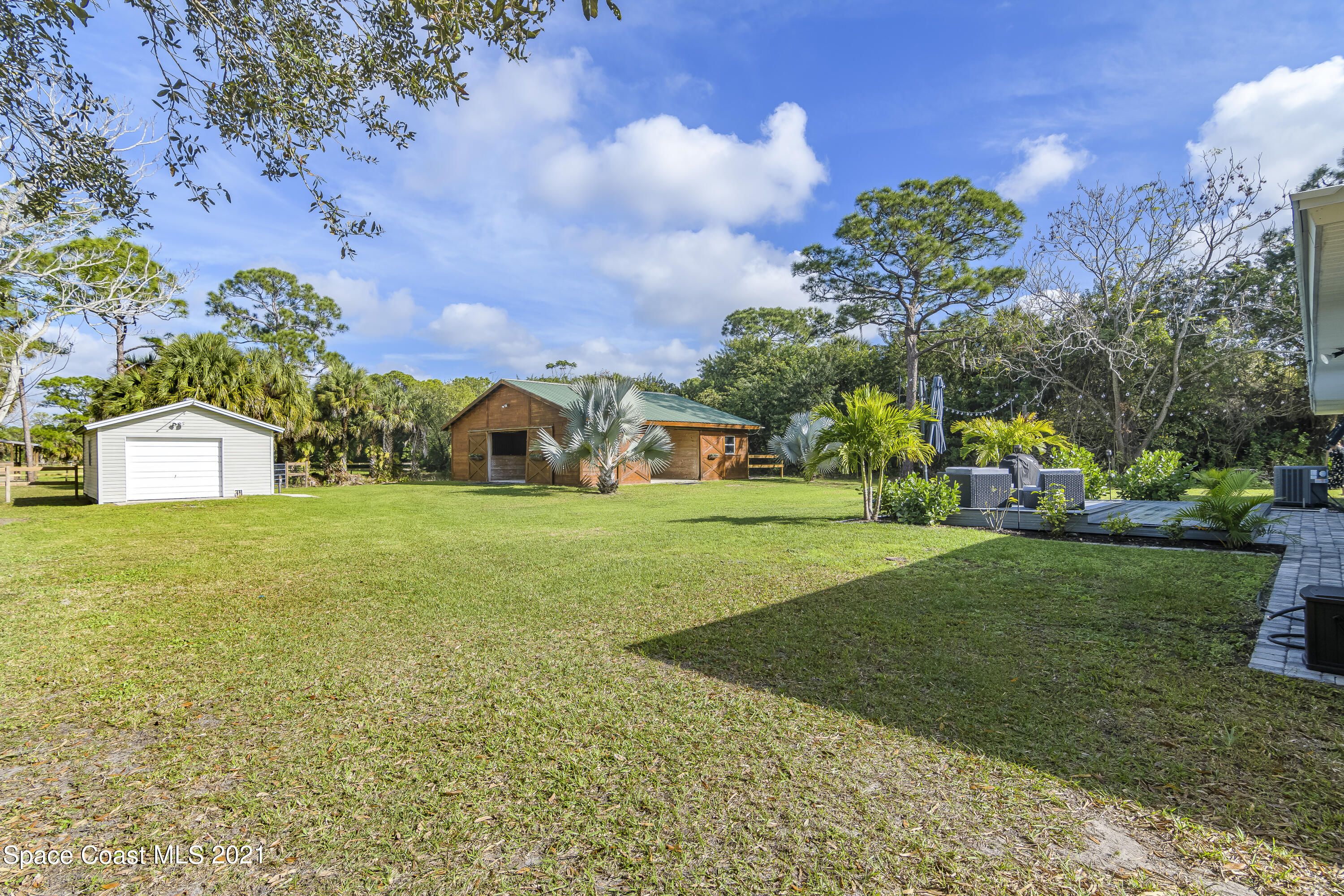 1740 Vally Road Malabar, FL 32950 - Photo 25 of 42 a front view of a house with garden
