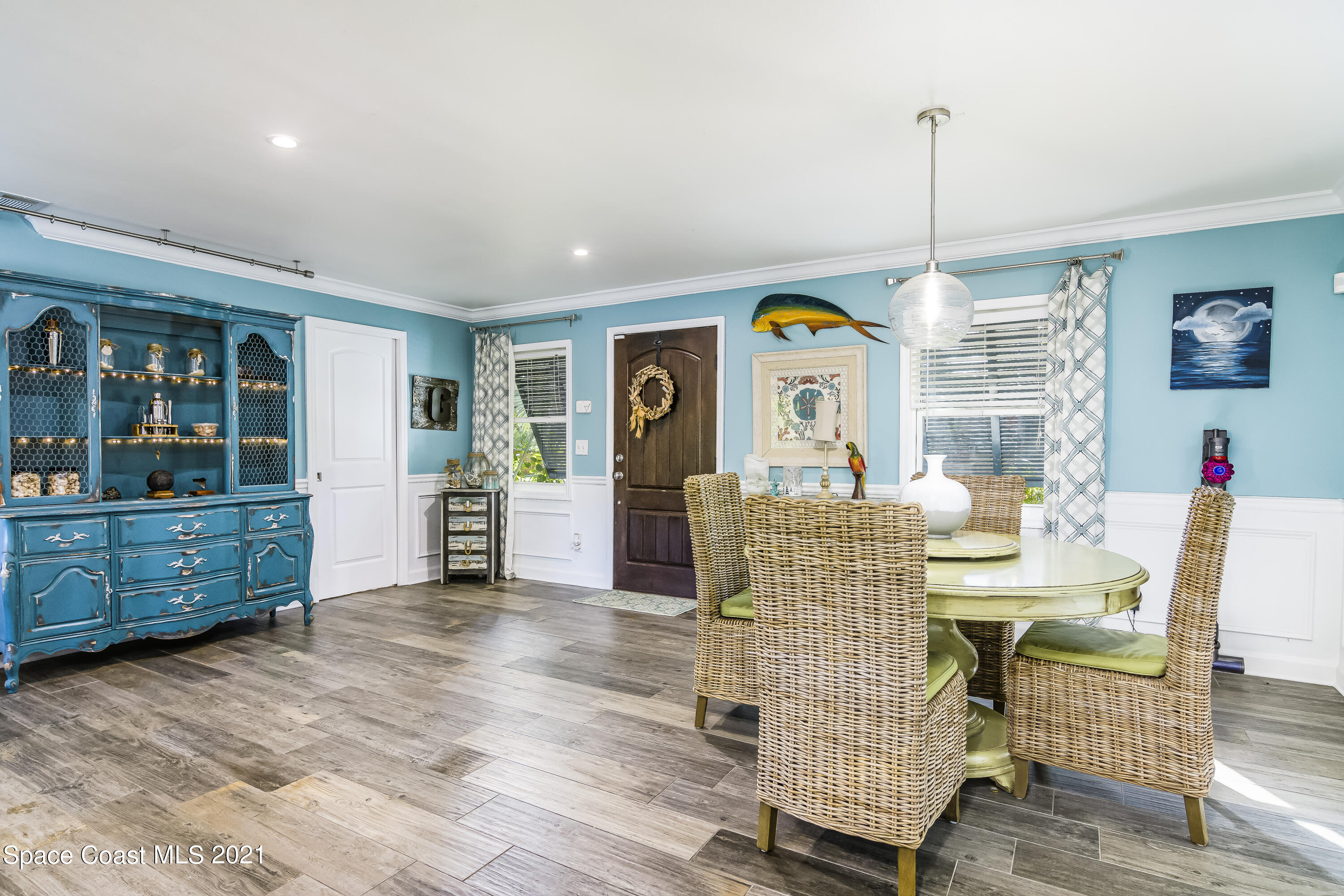 1740 Vally Road Malabar, FL 32950 - Photo 3 of 42 a view of an dining room with furniture window and wooden floor