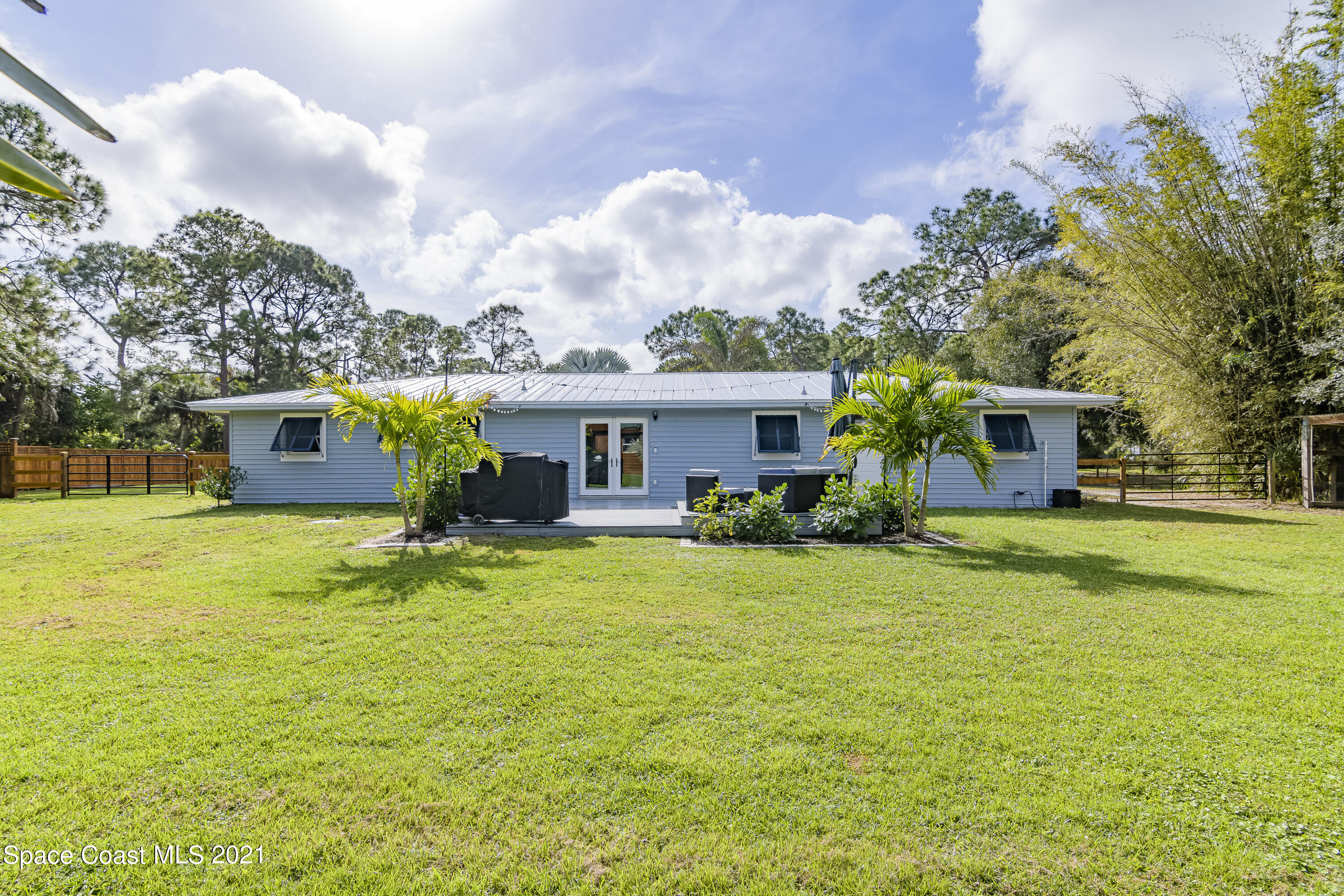 1740 Vally Road Malabar, FL 32950 - Photo 30 of 42 a front view of house with yard and green space