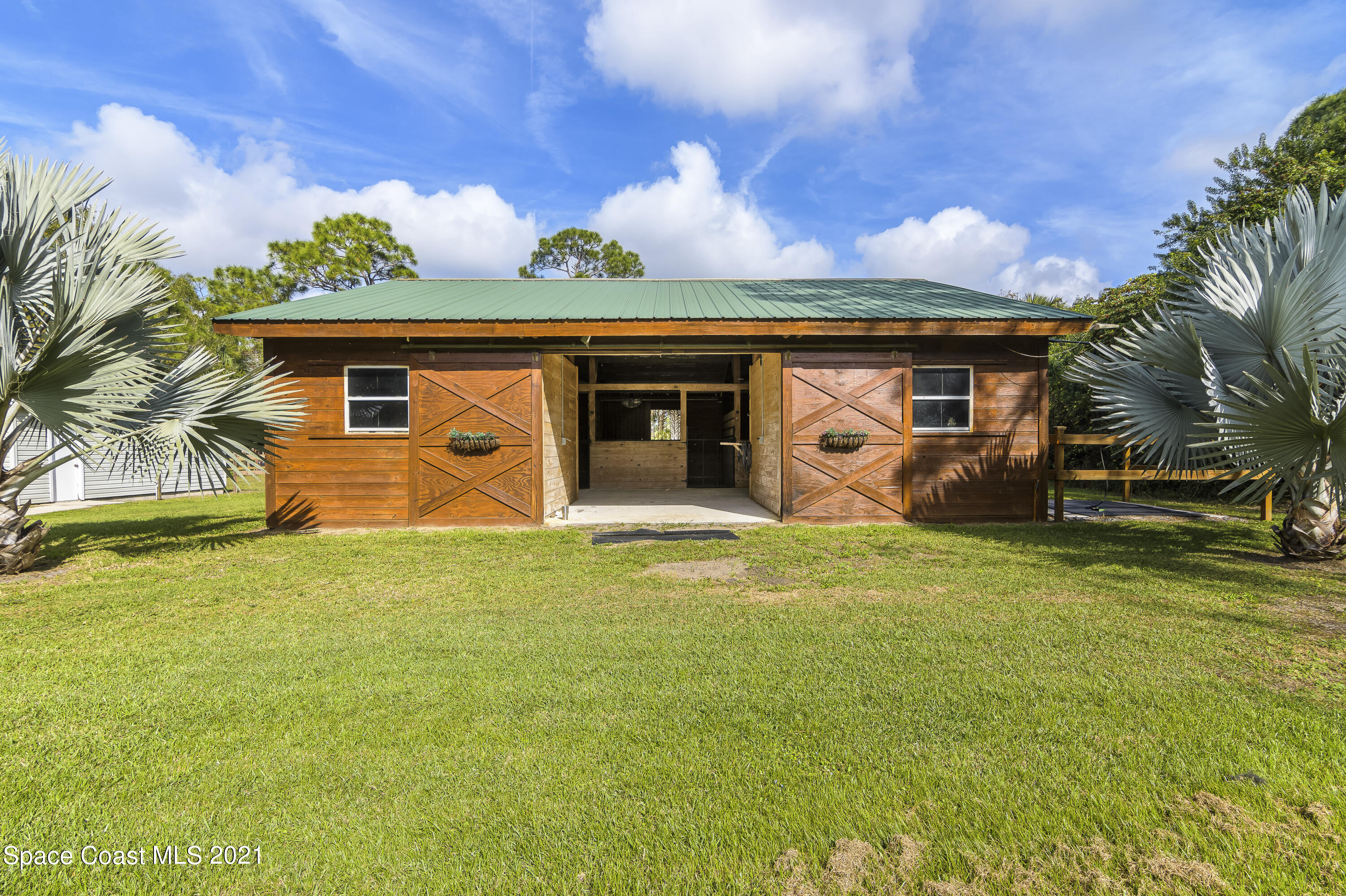 1740 Vally Road Malabar, FL 32950 - Photo 32 of 42 a front view of a house with garden
