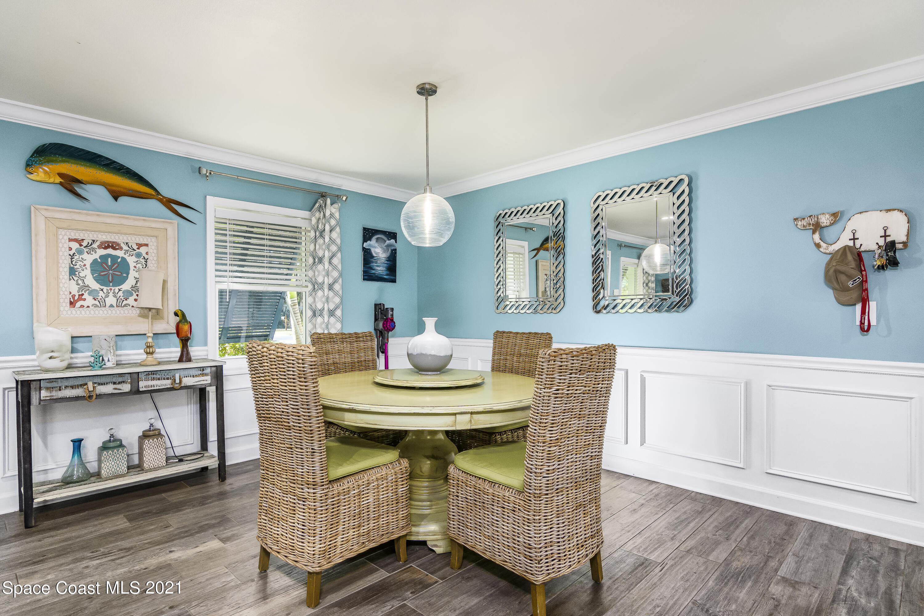 1740 Vally Road Malabar, FL 32950 - Photo 5 of 42 a dining room with furniture a window and wooden floor