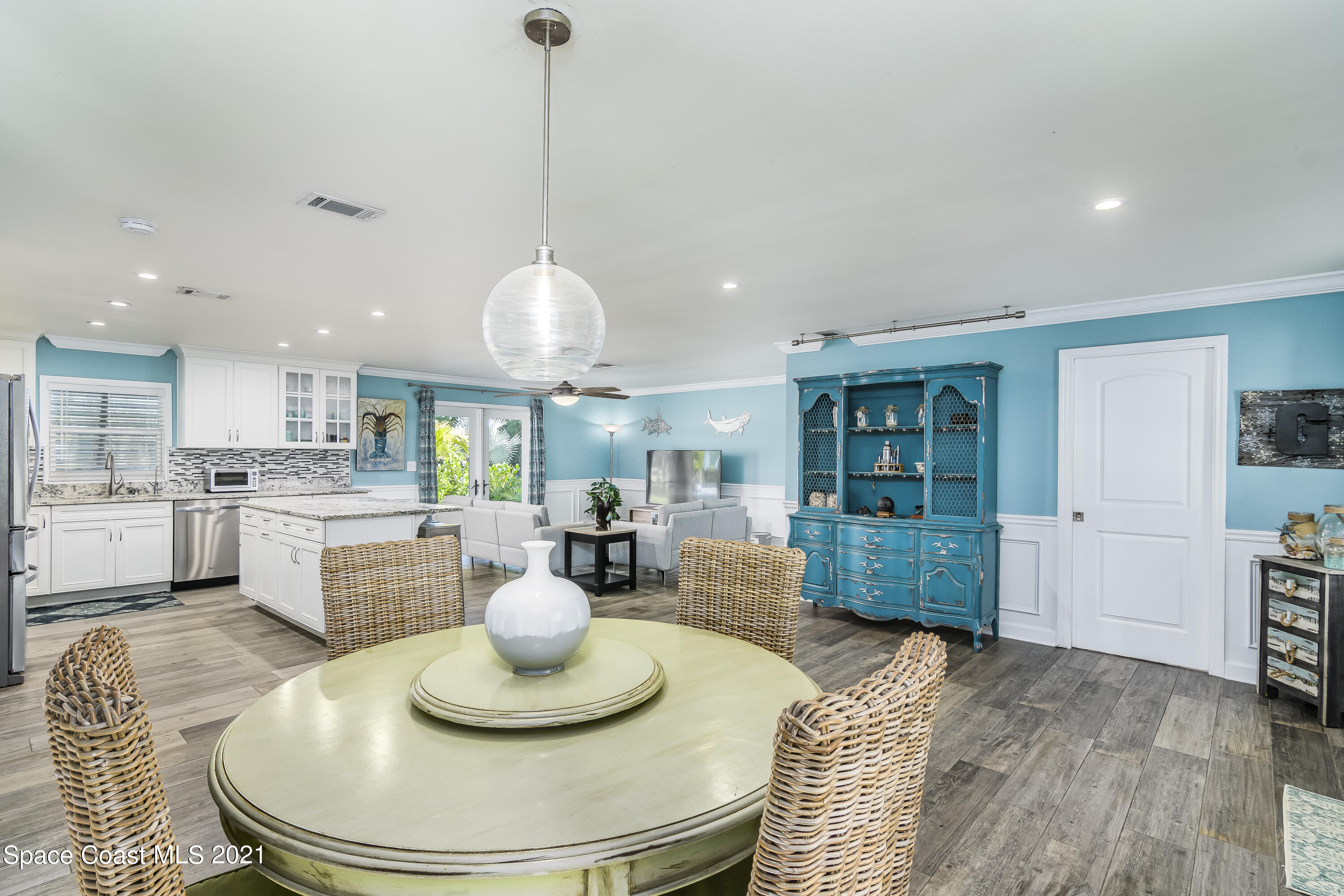 1740 Vally Road Malabar, FL 32950 - Photo 42 of 42 a dining room with furniture and a wooden floor